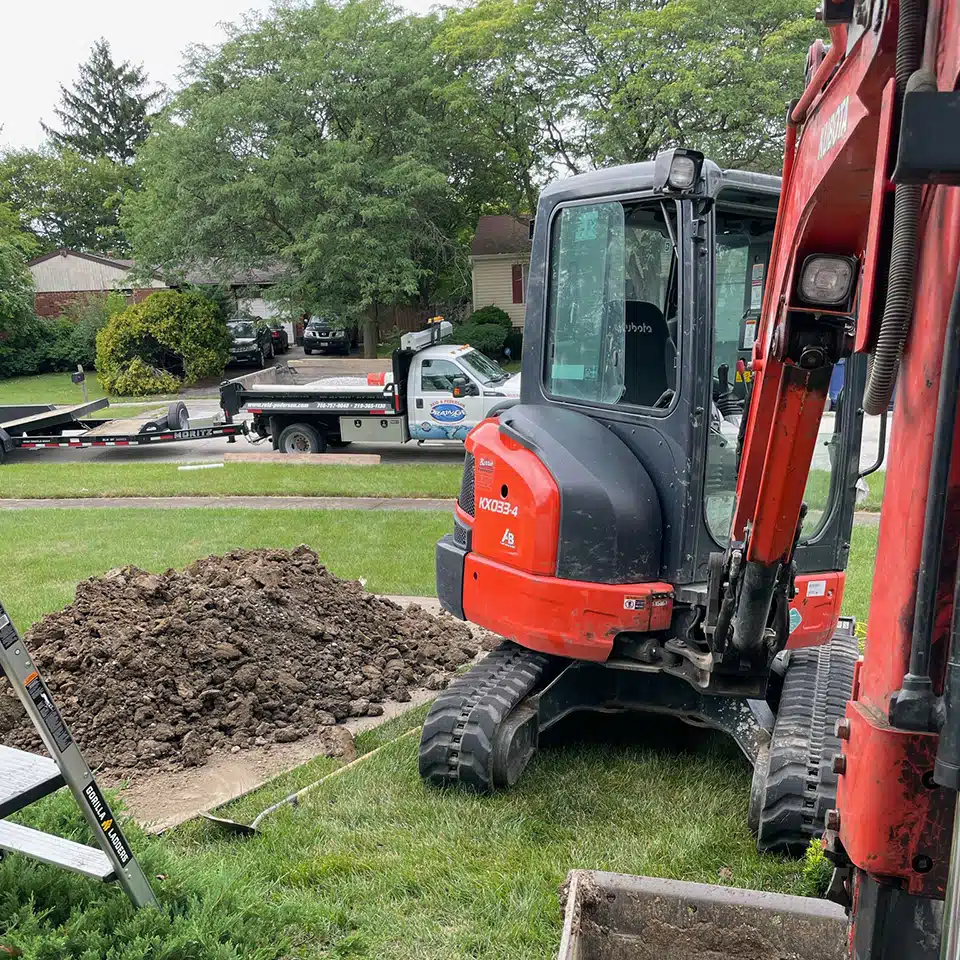 Reid & Pederson Drainage working in residential sewer in Crete, IL.