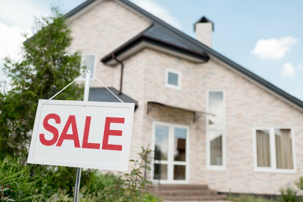 house with sale sign