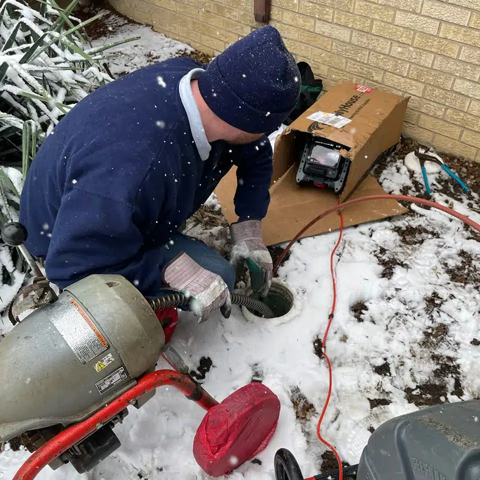 Reid & Pederson tech working on sewer line in Crete, IL.