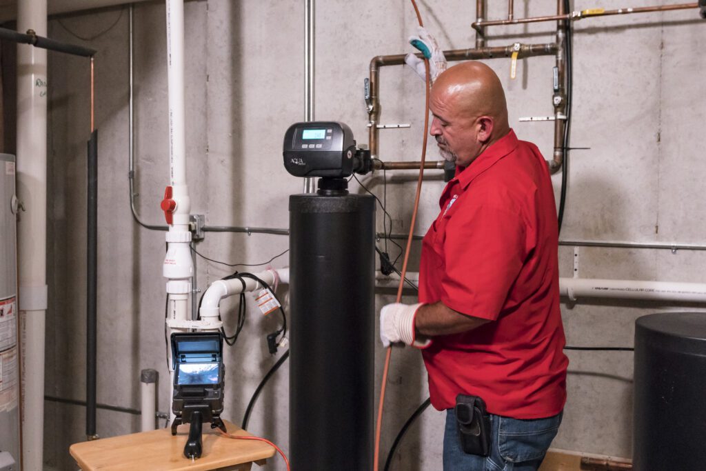 tech performing a televised sewer inspection