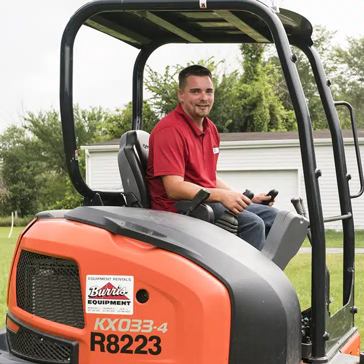 Reid and Pederson technician working in a mini compact excavator in Crete, IL.