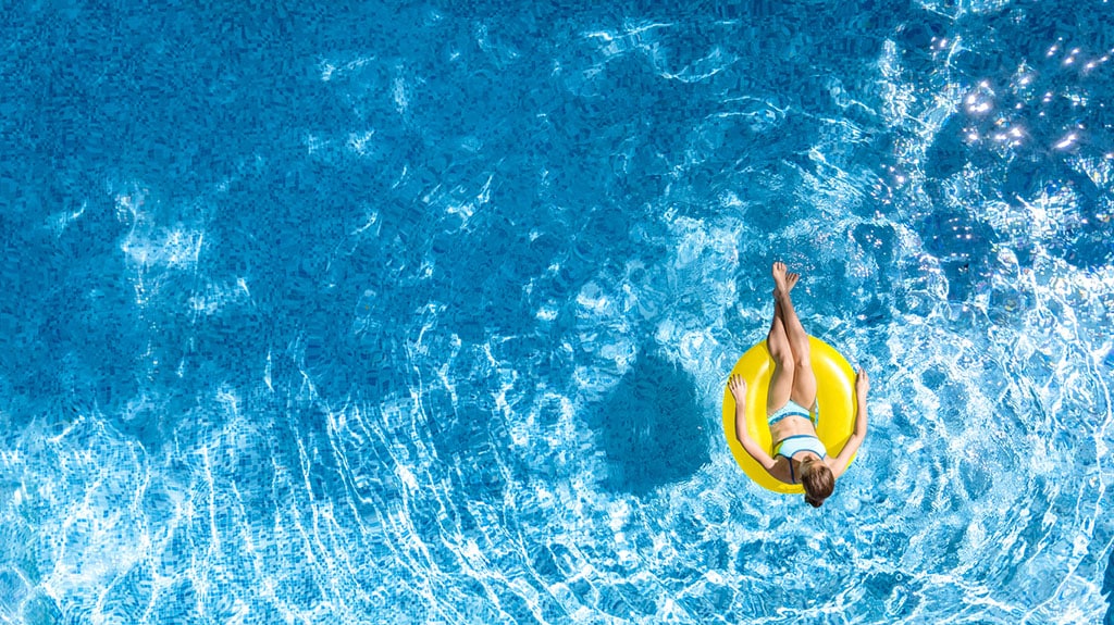 person in an innertube in a big swimming pool